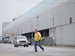 An auto worker at the Windsor Assembly Plant leaves after the morning shift March 18, 2020.  The afternoon shift was abruptly cancelled due to the ongoing COVID-19 pandemic.