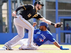 Toronto Blue Jays outfielder Josh Palacios beats the throw to second base after stumbling trying to steal second base against the Pittsburgh Pirates during the fourth inning at TD Ballpark.