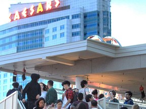 The sign at Caesars Windsor stands in the background of a crowd in this June 2019 file photo.