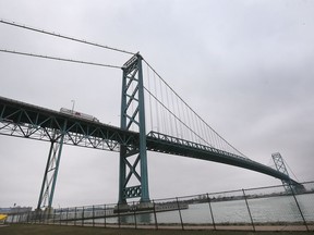 Transport truckers will be among the "essential" travellers still permitted to cross the international border by Saturday. The Ambassador Bridge spanning Windsor and Detroit is shown Thursday March 19, 2020.