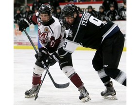 Chatham Maroons' Adrian Stubberfield (51) tangles with LaSalle Vipers' Evan Ferguson (9) in the third period at Chatham Memorial of Saturday's game in Chatham.