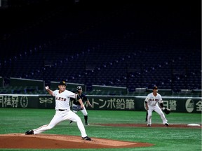 Spectator's stands are seen empty during the preseason of the baseball game of Yomiuri Giants and Tokyo Yakult Swallows, which is taking place behind closed doors amid the spread of the new coronavirus, at the Tokyo Dome in Tokyo, Japan, February 29, 2020.