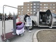 St. Clair College student McKenna Robinson packs her belongings into a truck at the main campus residence on Wednesday, March 18, 2020. The student was headed back to her home near London, ON.