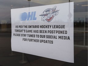 A sign is shown on a door at the WFCU Centre in Windsor on March 12, 2020. The Windsor Spitfires were set to take on the Saginaw Spirit. The Canadian Hockey League has postponed the season due to the COVID-19 virus.