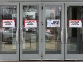 "Closed" signs on Devonshire Mall doors are shown on March 22, 2020. The mall was shut down due to the COVID-19 threat.