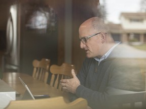 Mayor Drew Dilkens conducts work from his kitchen table while self-isolating himself after returning from a trip to Jordan, Tuesday, March 17, 2020.