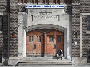 WINDSOR, ON. MARCH 5, 2020 -- A man who uses the Downtown Mission on a regular basis sits on the steps of the Victoria Ave. building in Windsor, ON. on Thursday, March 5, 2020.