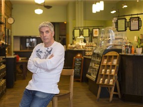Keeping social distance. Ron Balla, owner of The Coffee Exchange, shown March 19, 2020, is keeping his downtown business open, but only for takeout and without all the tables and chairs. The COVID-19 pandemic continues to wreak havoc on local businesses.