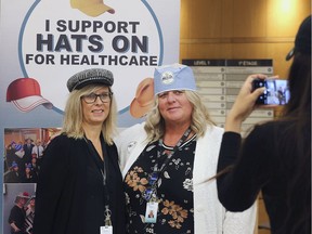 The Hats On For Healthcare fundraising event benefitting the Windsor Regional Hospital Foundation marked its 11th year on Wednesday, March 4, 2020. Janet Davis, left, and Christine Garant, staff at the Met Campus pose for the photo during the event.
