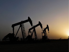 Pump jacks operate at sunset in Midland, Texas, in this Feb. 11, 2019, file photo.