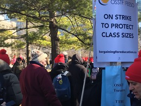 Teachers march at Queen's Park in Toronto on Thursday