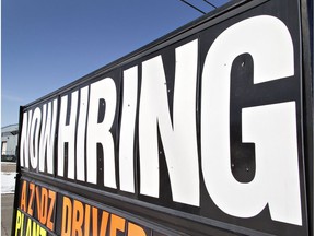 A now hiring sign is pictured.