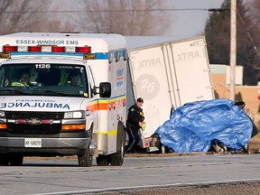 An ambulance waits at the scene of a fatal crash between a tractor trailer and a pickup truck in the Lakeshore area on March 2, 2020. The pickup truck driver was pronounced dead at the scene.