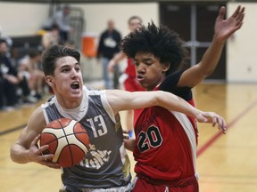 WINDSOR, ON. MARCH 9, 2020 --Quinn Carey, left, of Riverside Secondary battles Tavian Quest-Palacios of Parkdale Collegiate during their OFSAA AA tournament game on Monday, March 9, 2020, at Riverside Secondary in Windsor, ON.