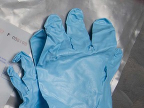Blue sanitary gloves are shown in this May 2017 file photo.