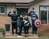 A family, including two superheroes, have a self-isolation portrait taken outside their home by Windsor photographer Jessica Tanchioni.