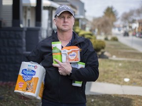 Mark Jones, who is assisting seniors by delivering supplies during the COVID-19 pandemic, is pictured on Pierre Avenue on March 17, 2020.