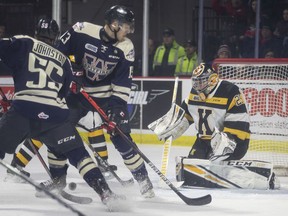 WINDSOR, ONT:. MARCH 1, 2020 -- Windsor's Will Cuylie and Wyatt Johnston, left, scramble for the puck in front of Kingston goalie, Ryan Dugas, in OHL action between the Windsor Spitfires and the Kingston Frontenacs at the WFCU Centre, Sunday, March 1, 2020.