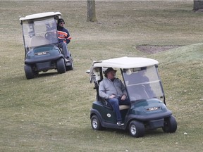 Golfers are shown at Orchard View Golf Club in Ruthven on Tuesday, March 24, 2020.