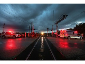 Emergency personnel investigate a possible fatal train/pedestrian accident just west of Renaud Line in Lakeshore between County Rd. 22 and 42. This photo earned Dan Janisse and Ontario Newspaper Award nomination.