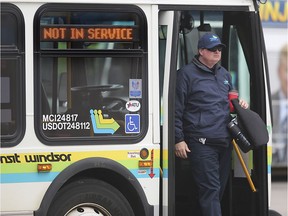 A Transit Windsor bus driver steps off a bus at the downtown terminal in Windsor on Thursday, March 26, 2020. The city announced that all buses will be temporarily shut down due to the COVID-19 pandemic.