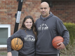 Jimmy Parsons is shown with his daughter Savannah, 13, at his LaSalle home. Since the COVID-19 stay at home orders he has organized virtual practices for his U14 girls basketball team.