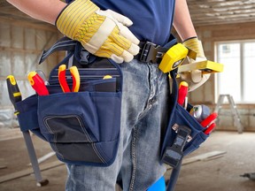 A worker with construction tools.