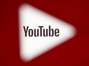 A 3D-printed YouTube icon is seen in front of a displayed YouTube logo in this illustration taken October 25, 2017. (REUTERS/Dado Ruvic/Ilustration/File Photo)