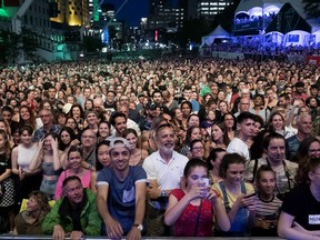 A large crowd waits for Charlotte Cardin to perform the opening concert of the Montreal International Jazz Festival in Montreal, on Thursday, June 27, 2019.