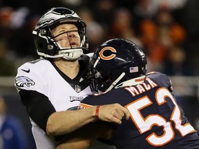 Khalil Mack of the Chicago Bears hits Nick Foles of the Philadelphia Eagles in the fourth quarter of the NFC Wild Card Playoff game at Soldier Field on January 06, 2019 in Chicago, Illinois.