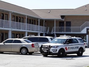 Windsor police vehicles posted at the Motel 6 at 2000 Huron Church Rd. on April 2, 2020, in relation to a gun homicide on Northway Avenue.