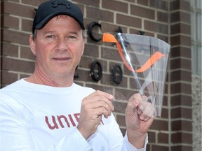 COVID-19 help from the auto sector. John D'Agnolo of Unifor Local 200 holds a face shield produced by autoworkers at Ford Motor Company of Canada's Windsor Engine Plant on April 7, 2020.