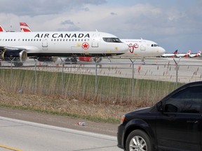 Despite having closed to passenger commercial service last week due to COVID-19, Windsor International Airport has become a destination for idled passenger jets, like these ones seen from County Road 42 on April 9, 2020.