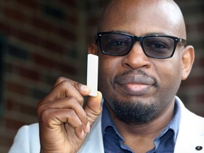 Audacia Bioscience co-founder Phillip Olla holds a COVID-19 test kit Monday which provides results within minutes and is now in a clinical trial at  Henry Ford Hospital in Detroit.