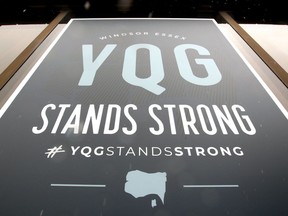 Windsor, Ontario. April15, 2020.  YQG Stands Strong poster in window of Tourism Windsor Essex Pelee Island Wednesday.