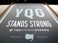 Windsor, Ontario. April15, 2020.  YQG Stands Strong poster in window of Tourism Windsor Essex Pelee Island Wednesday.