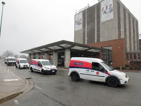 Windsor, Ontario. April15, 2020.  Dozens of Canada Post vehicles circle Met Campus of Windsor Regional Hospital Wednesday.