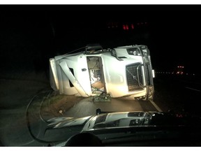 A tractor trailer is seen on its side in a ditch on Highway 401 in Chatham-Kent on Tuesday, April 21, 2020.