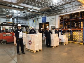 Staff at BASF in Windsor are seen with shipments  hand sanitizer produced at the plant recently to respond to shortages in the midst of the COVID-19 crisis.