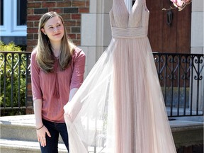 Windsor, Ontario. April 27, 2020.  F.J. Brennan student Mira Gillis admires her prom dress Monday.  Prom has been cancelled but Gillis looks at the bright side, knowing her classmates will be healthy as they move on to post-secondary schools.  Gillis will be studying political science at Toronto or Carlton.  See story.