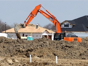 Construction boom to start the year. Heavy equipment prepares the ground for more new homes in Amherstburg's Kingsbridge neighbourhood near Whelan Drive, shown April 28, 2020.