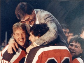 Spitfires coach Tom Webster, top, is carried off the ice by J.P. Gorley, centre, Jamie Allen, centre, and Kelly Cain after Windsor won the 1987-88 OHL title in 1988.