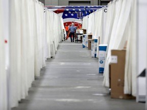 Shown April 6, 2020, cubicles are installed in one of the convention halls at TCF Center (former Cobo Center) as it is converted into a field hospital in Detroit for coronavirus patients.