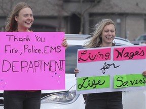 Family members of residents at the Village of Aspen Lake long-term care facility in Windsor held a rally on Saturday, April 18, 2020, to thank staff for their efforts through the pandemic. Olivia Moluchi, left, and Hannah Moluchi are shown during the event.