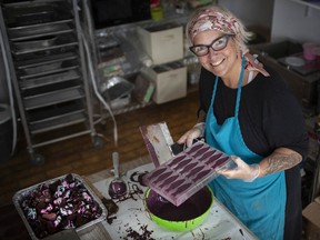 Essential sweetness. Michele Bowman, owner of Sweetness Chocolate Co., is shown April 9, 2020, preparing an order of chocolate for Easter. Ontario Premier Doug Ford recently issued a written proclamation announcing that the Easter Bunny is an essential worker.