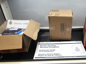 Boxes with large quantities of suspected cocaine in them, seized by the Canada Border Services Agency at the Ambassador Bridge on March 17, 2020.