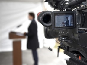 Prime Minister Justin Trudeau is seen on the screen of a broadcast camera as he speaks during his daily press conference on the COVID-19 pandemic, outside his residence at Rideau Cottage in Ottawa, Friday, April 24, 2020.