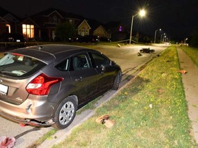 The scene in the 200 block of Amy Croft Drive in Tecumseh on the night of July 19, 2019, after a motorcycle struck a parked vehicle.