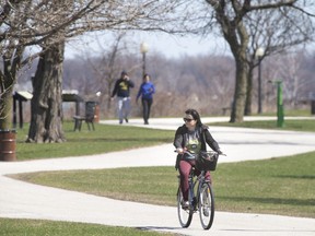 Walkers and bicycle riders were numerous in Windsor's riverfront park on April 2, 2020.