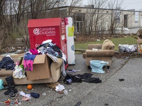 Stop dumping. A donation bin on Hildegarde Street, off Ouellette Avenue, is shown on April 7, 2020, with items strewn around it. Charities have warned that they are no longer receiving donations due to the COVID-19 pandemic.